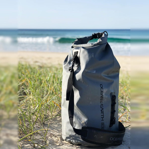 The Ocean & Earth duffle bag, sitting by the seaside, loving watching the waves.