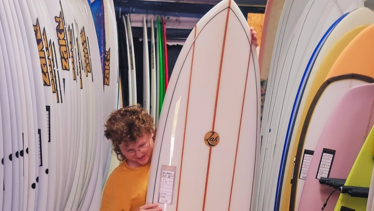 This is one for the ages! This board is a one-off triple stringer mid length with a gloss finish from legendary Torquay shaper Doug Rogers. 