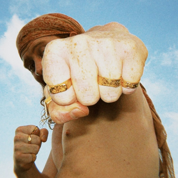 Close-up of handcrafted silver Salty Dagger ring with ocean-inspired texture, photographed in natural light.