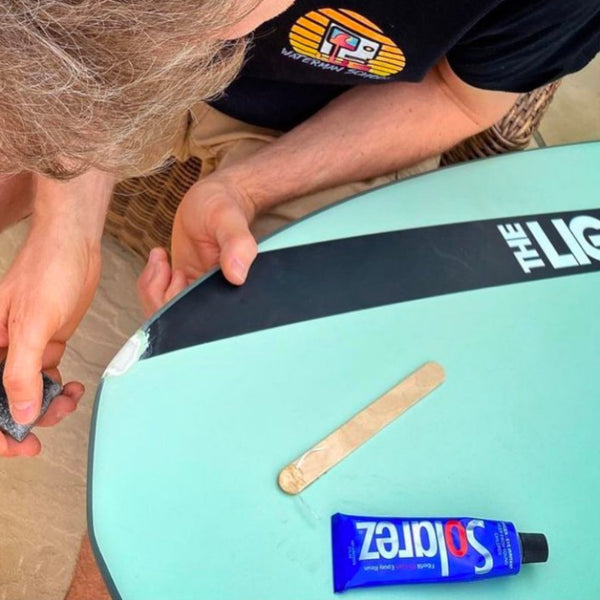 using the Solarez repair kit to fix a ding repair on the fly.