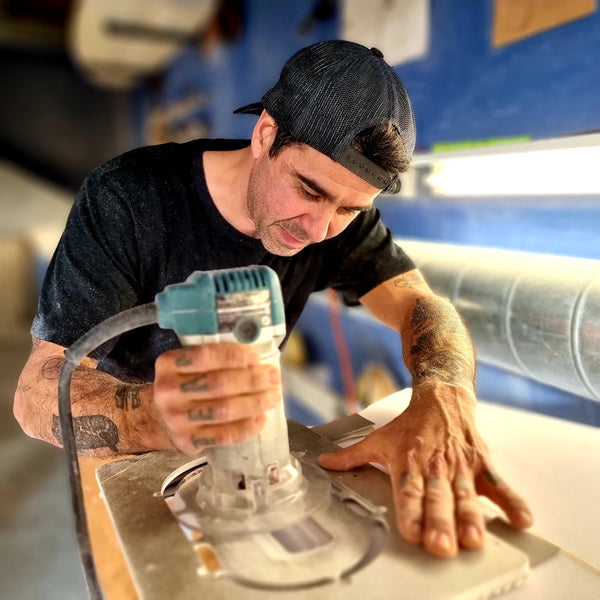 Installing surfboard fins using the fin kits template