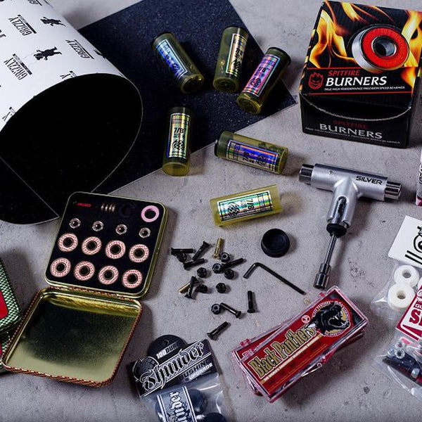 Skateboard Accessories including tools, bearings and bolts.